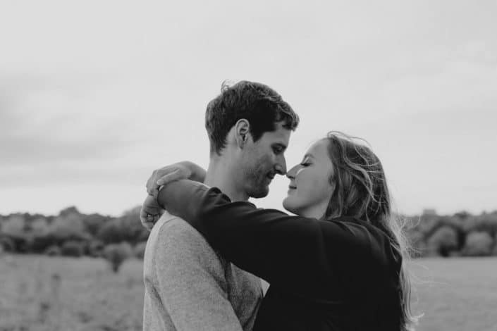 Mum and dad are looking at each other and smiling to each other. Maternity session in Basingstoke Hampshire. Ewa Jones Photography