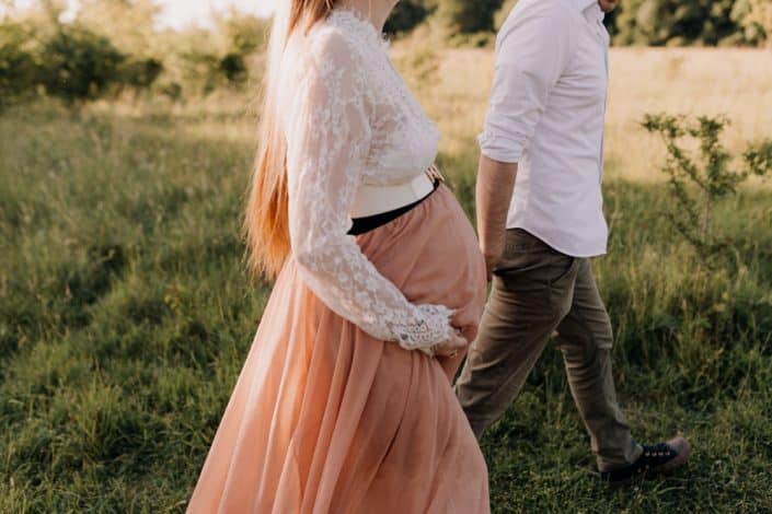 maternity photo shoot in the fields. Mum is wearing lacy dress. Intimate maternity shoot. Hampshire photographer. Ewa Jones Photography